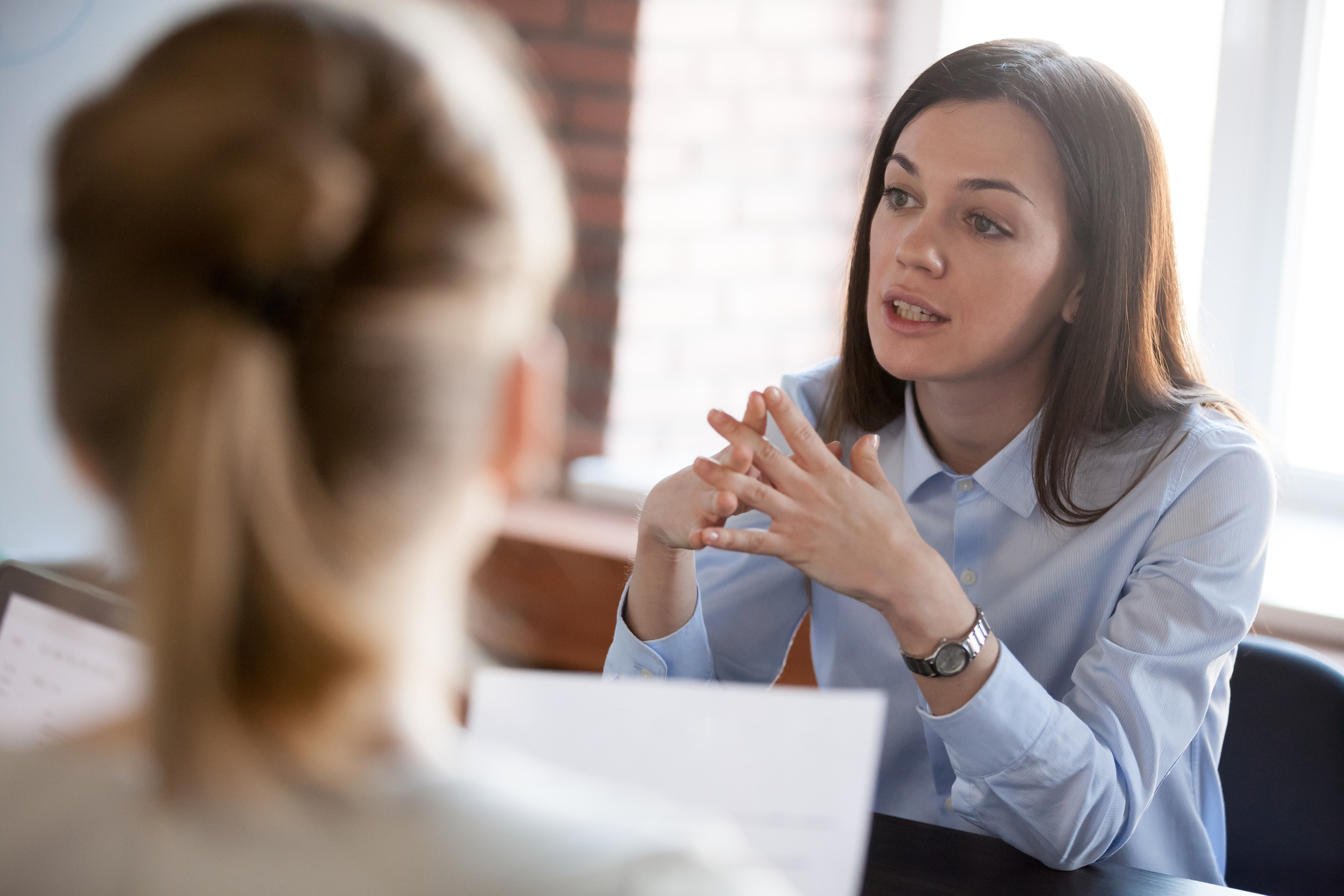 Serious discussion between two businesswomen