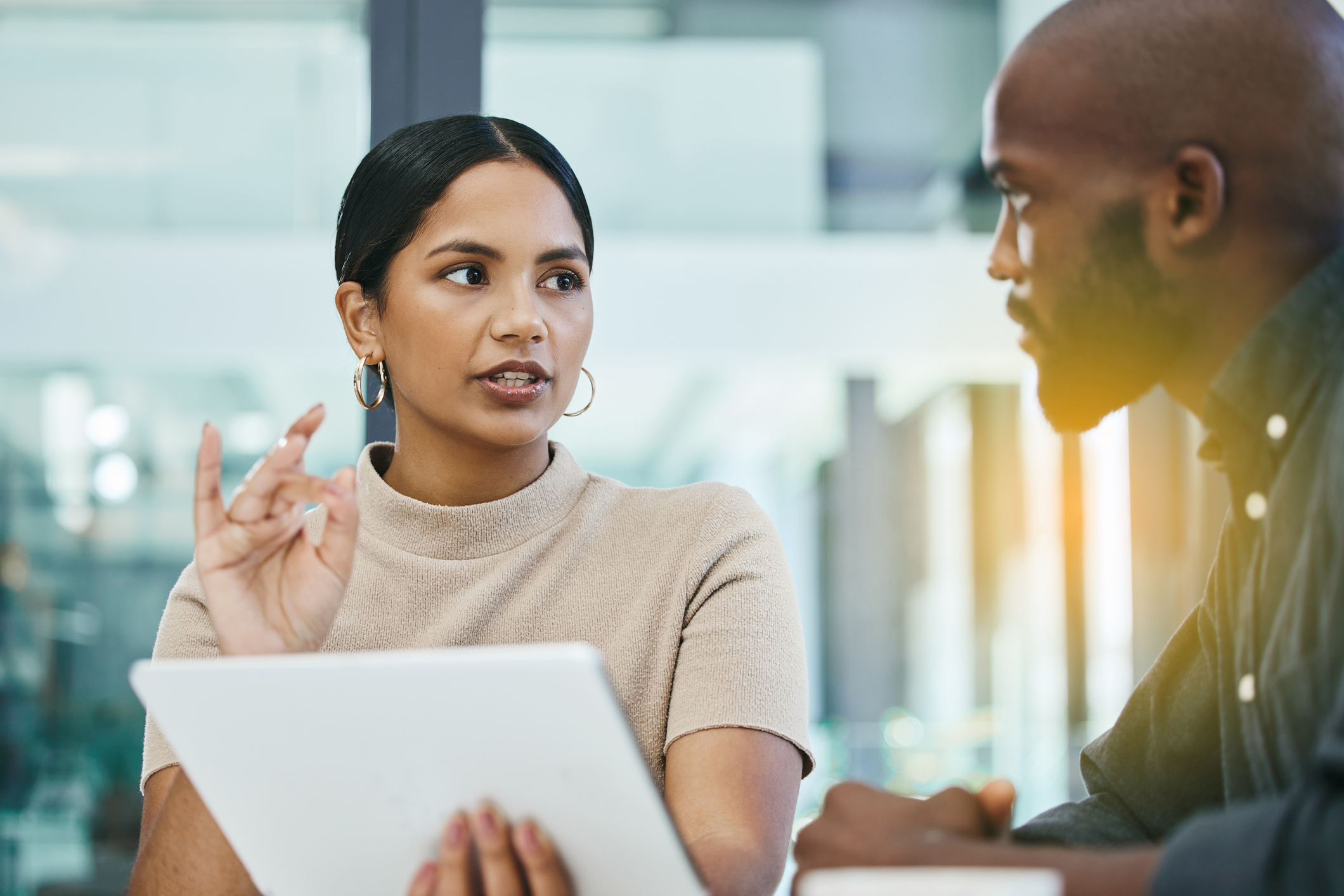 Male and female colleague having a serious discussion