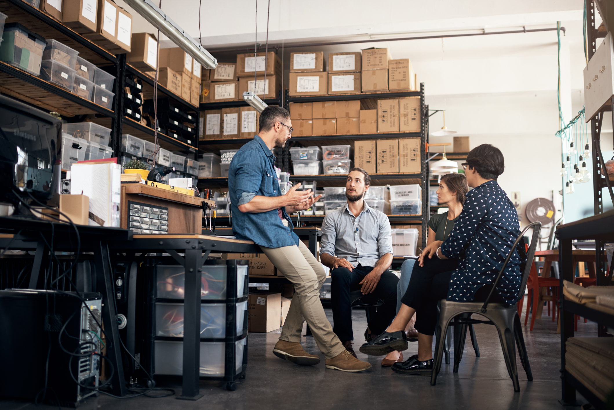 Colleagues having a discussion in a workshop.